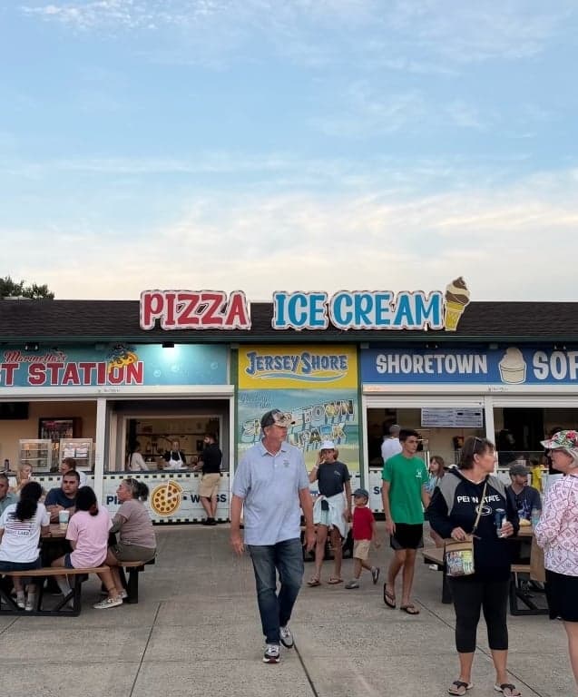A boardwalk pizza and ice cream stand shot on a stock iPhone
